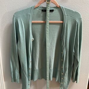 Cardigan sweater with matching belt.
